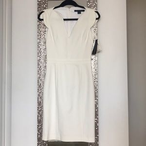White body hugging knee length dress